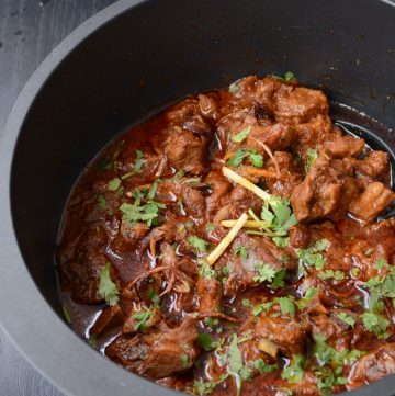 Slow cooked lamb curry in black pot