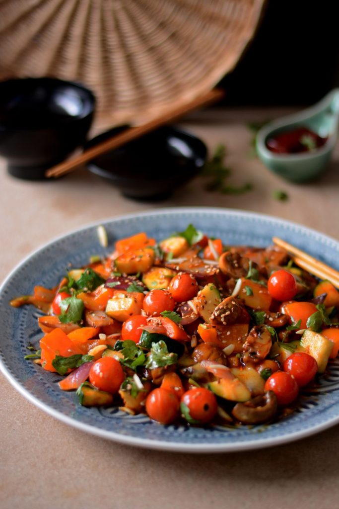 Vegetable stir fry served on blue plate