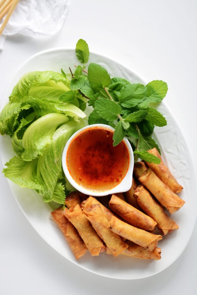 Fried prawn spring rolls served with lettuce, mint and dipping sauce