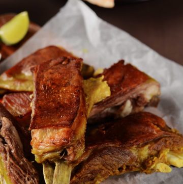 Indian style lamb ribs on white baking paper