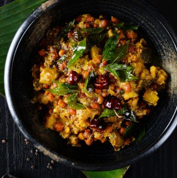 Chickpea and plantain curry served in black bowl