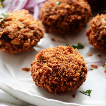 close up of tuna croquette on a white plate