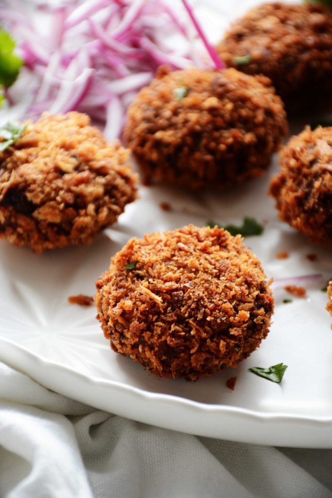 close up of tuna croquette on a white plate