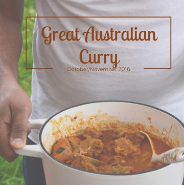 Man holding a pot of goat curry