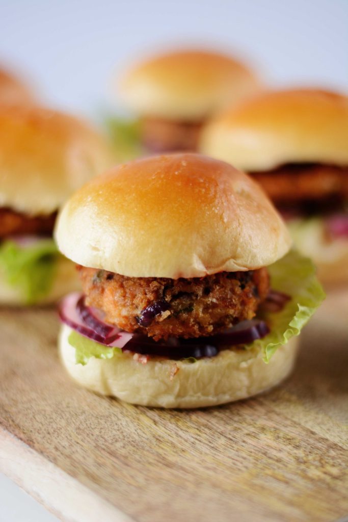 Close up of salmon slider in brioche bun