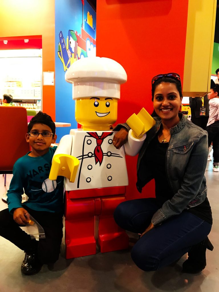Woman and child near Lego model