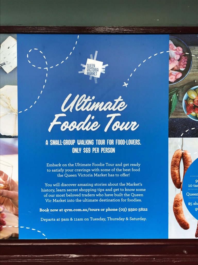 Blue signboard advertising food tour
