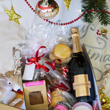 gift hamper with wine, cookies, spice blends, fruit cake