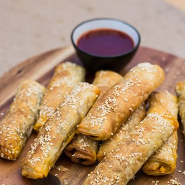 lamb cigar rolls on wooden platter