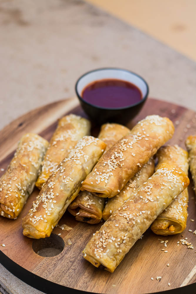 lamb cigar rolls on wooden platter