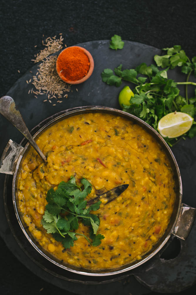 Rice with lentils in bowl and spices on the side