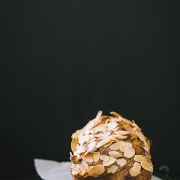 a loaf of banana bread with almond flakes