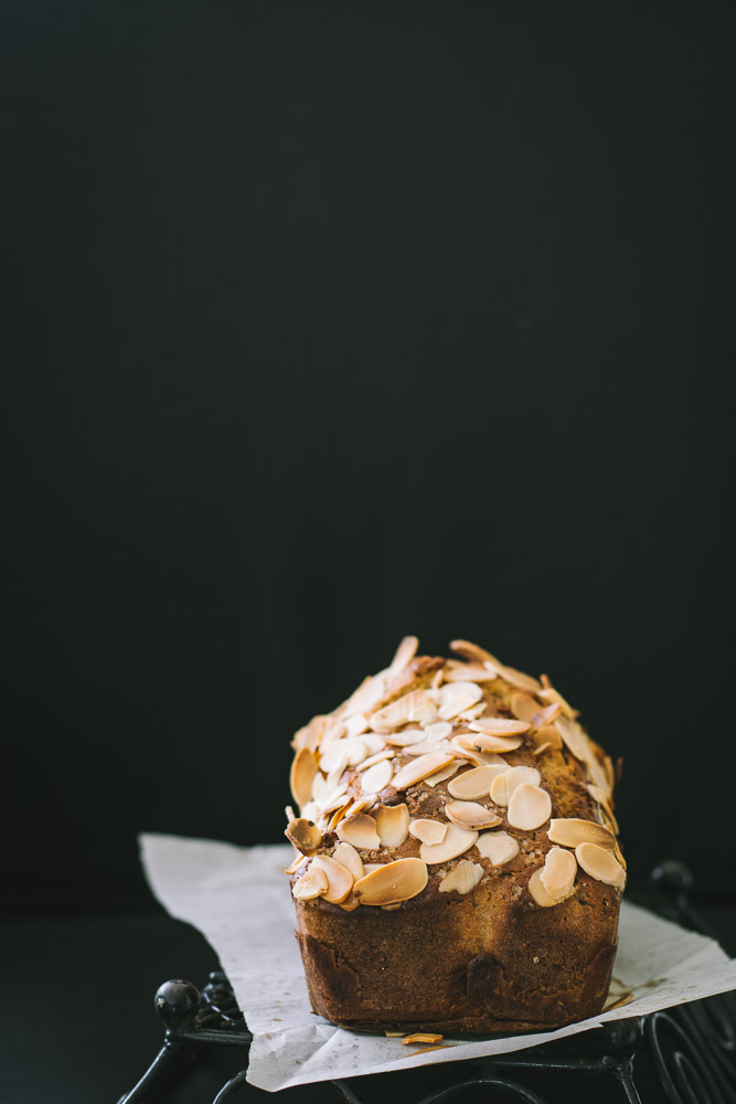 a loaf of banana bread with almond flakes