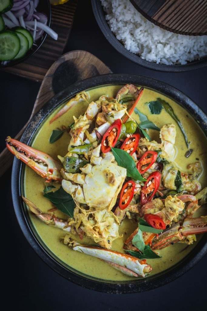 Fiji style crab curry in black bowl