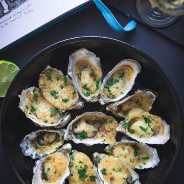 oysters with almond and butter in black pan