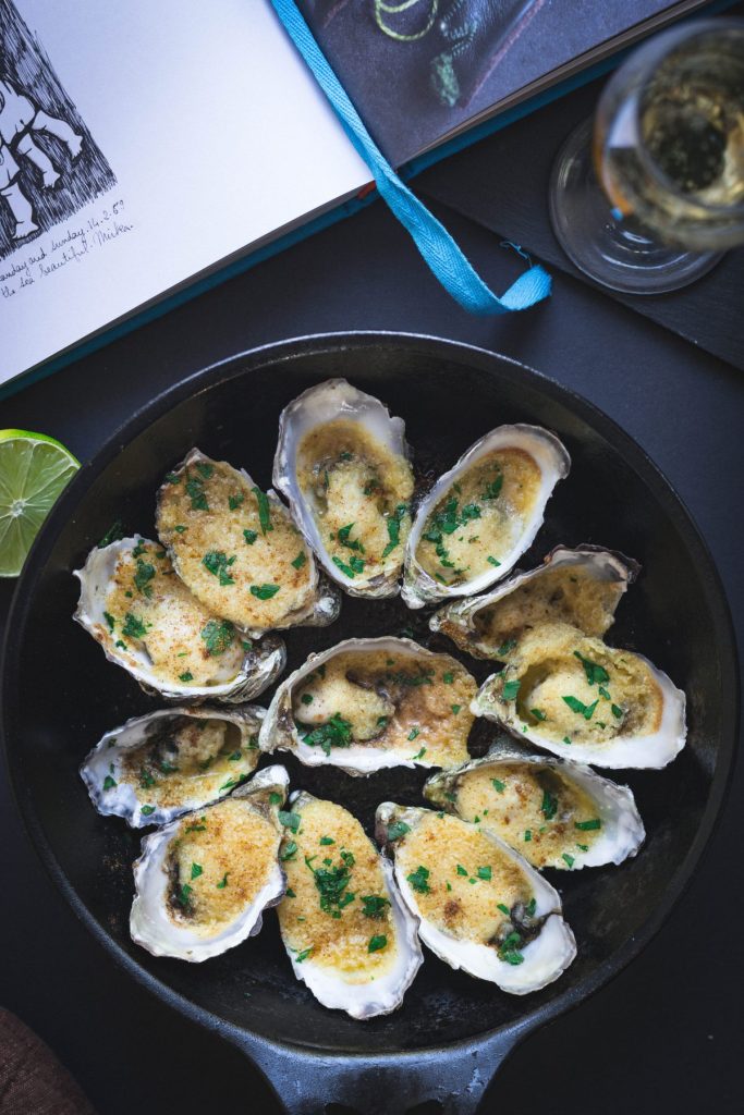 oysters with almond and butter in black pan