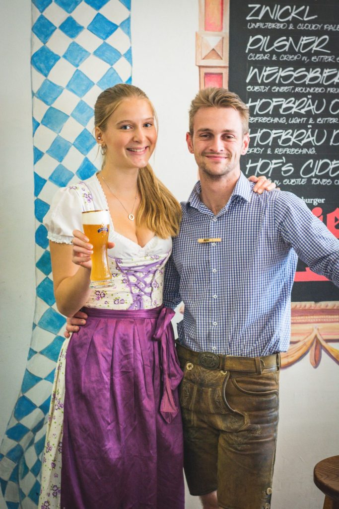 man and woman holding beer