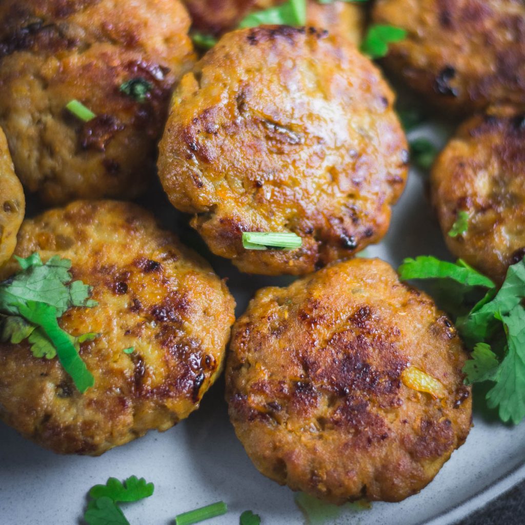 close up of tuna kebabs with chopped coriander garnish