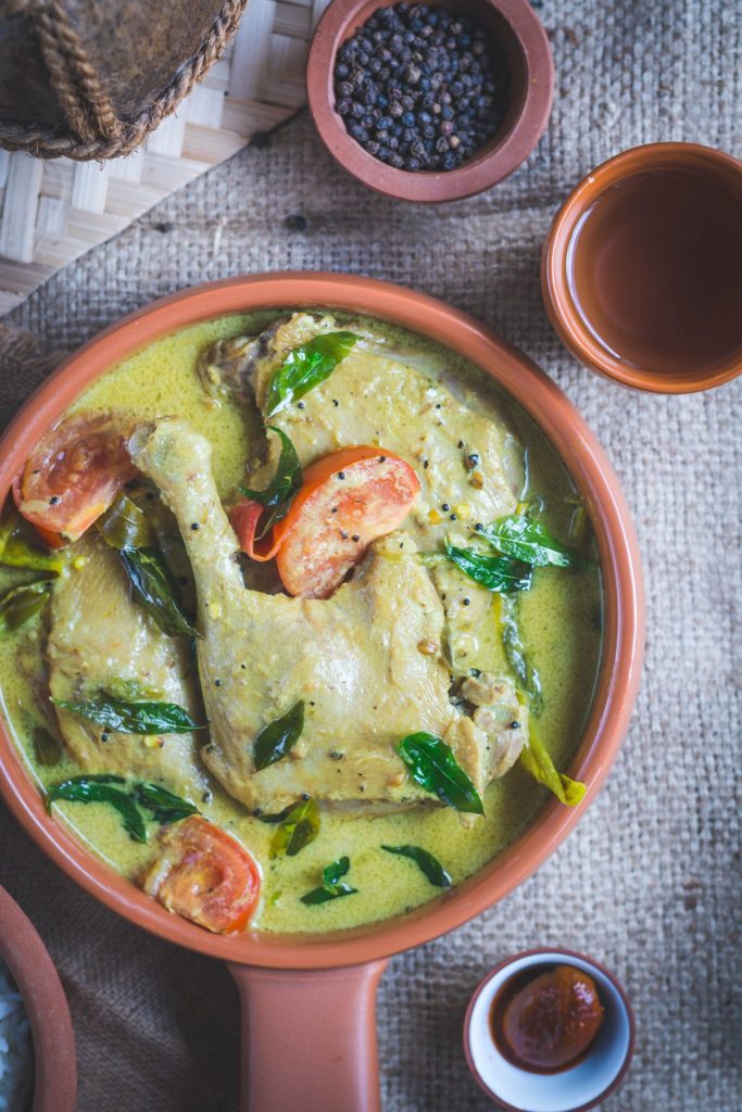 Duck curry in terracotta bowl