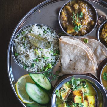 Indian meal with several dishes on a large plate