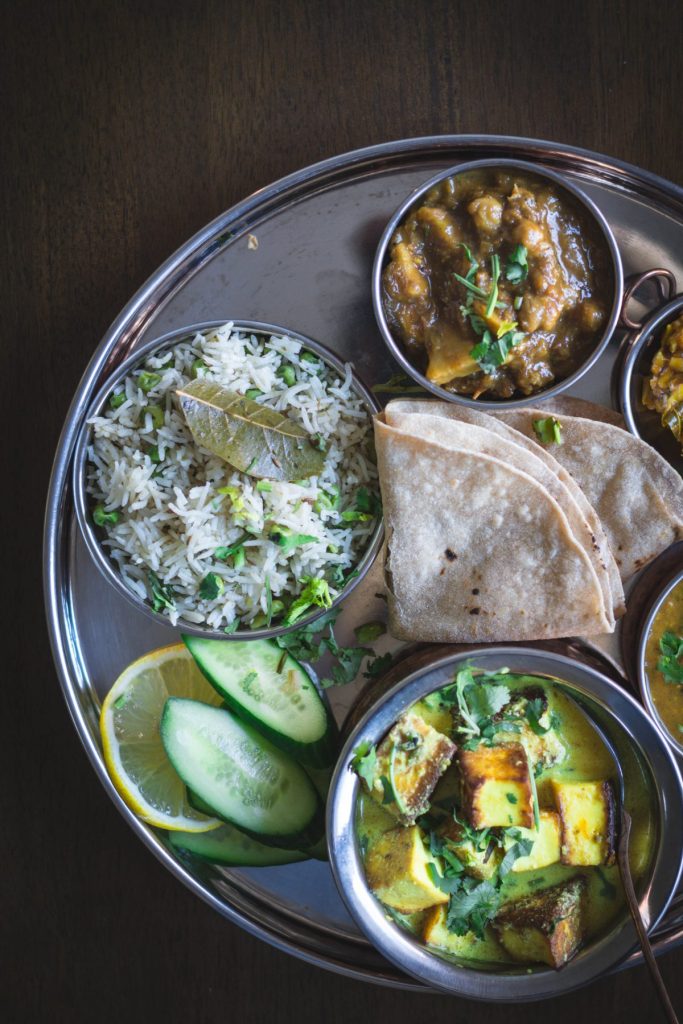 Indian meal with several dishes on a large plate