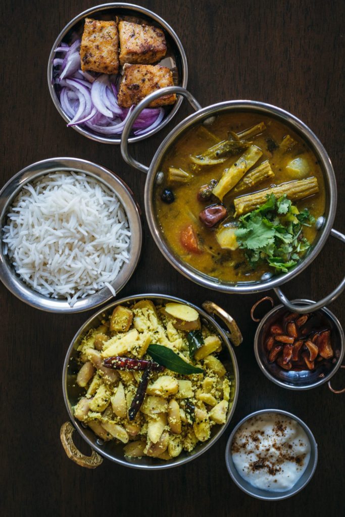 a selection of 6 Indian dishes served in individual bowls