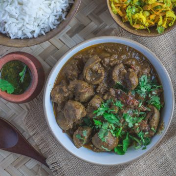 mutton kidney curry with spices in white bowl