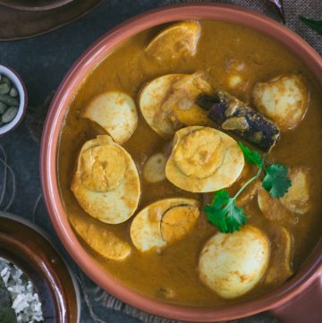 Indian style egg curry in terracotta bowl