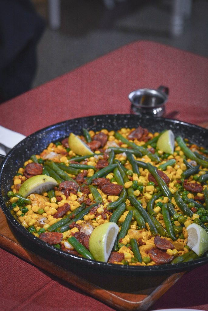 Paella served in black pan