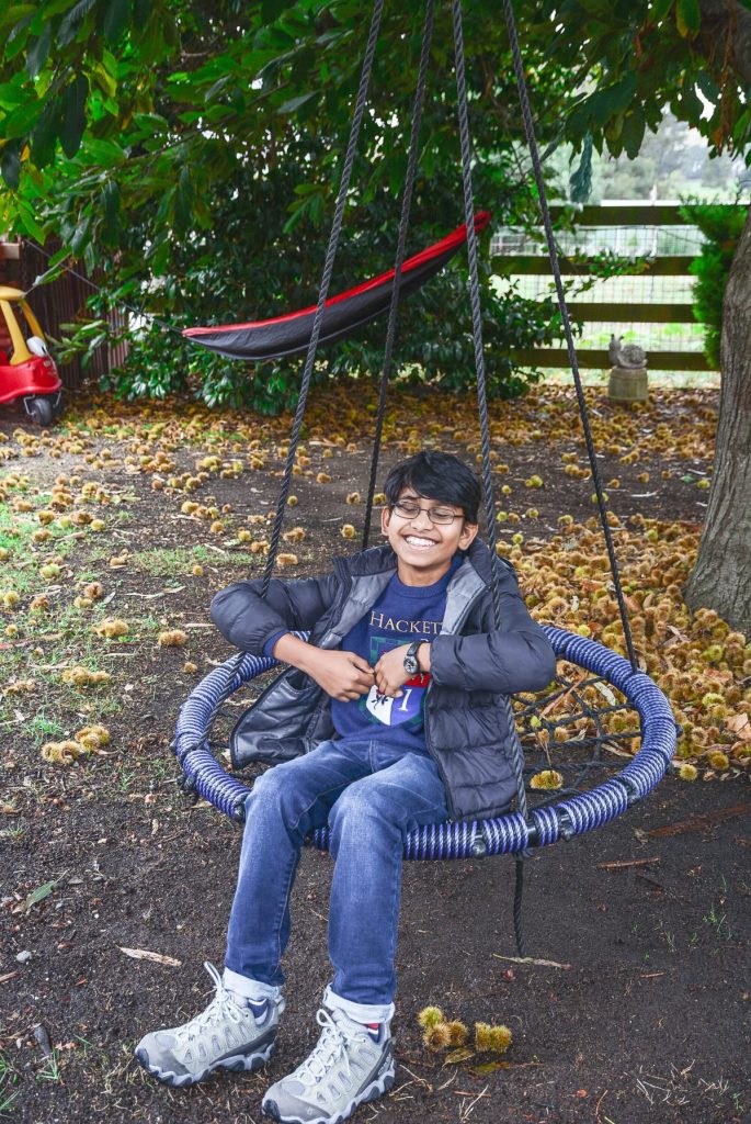 boy on blue swing