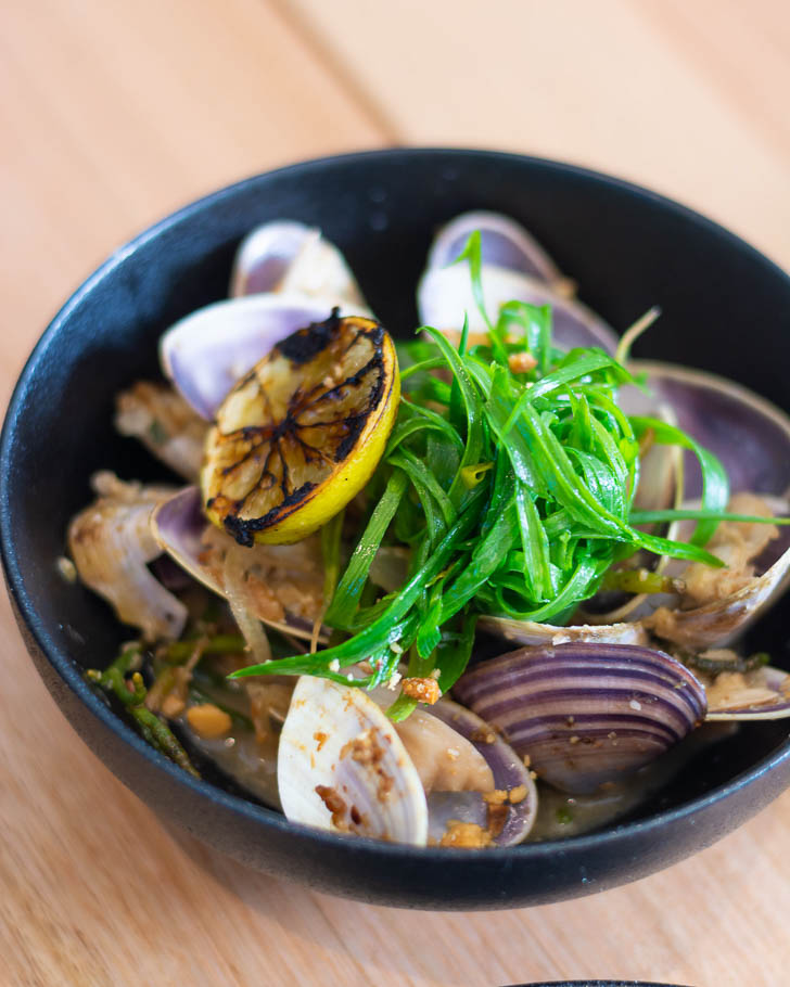 Bush tomato pippies with samphire, sea parsley, macadamia and charred lime