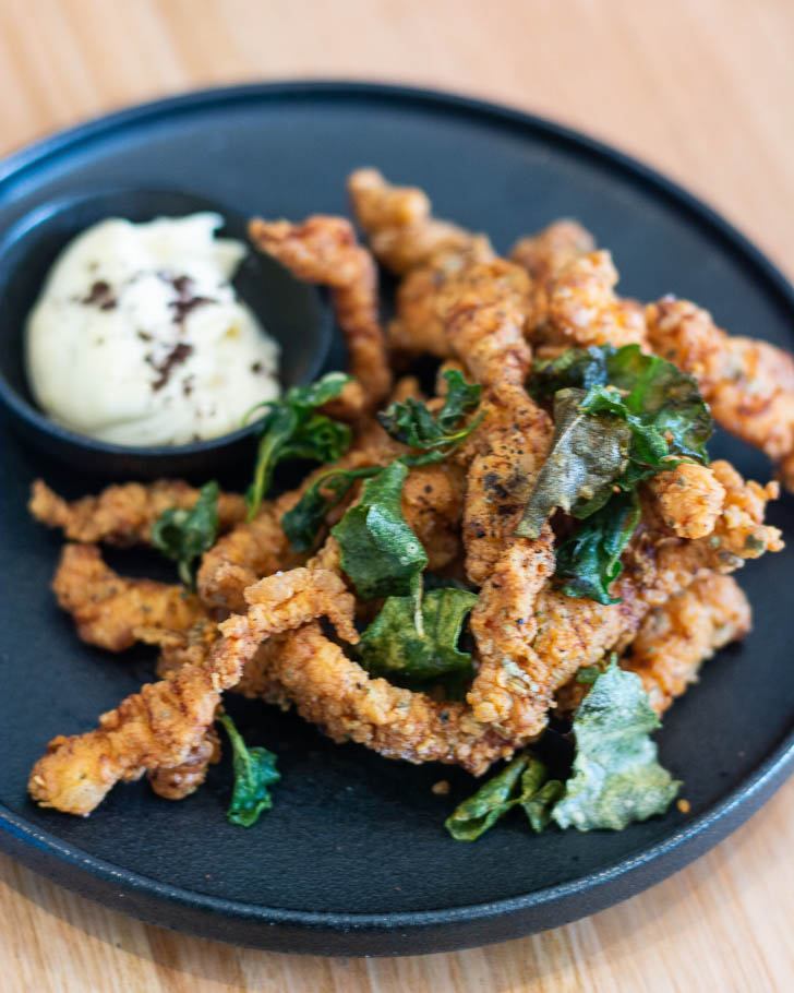 Saltbush and pepperberry fried crocodile with smoked oyster aioli