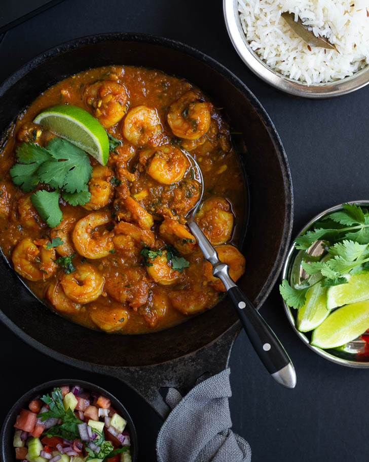 prawn curry in black cast iron pan