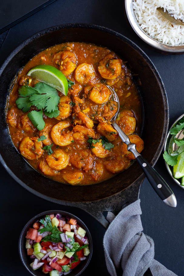 prawn curry in black cast iron pan