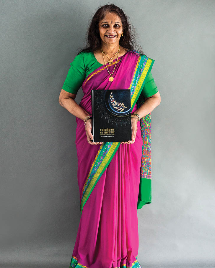 lady in saree holding cookbook