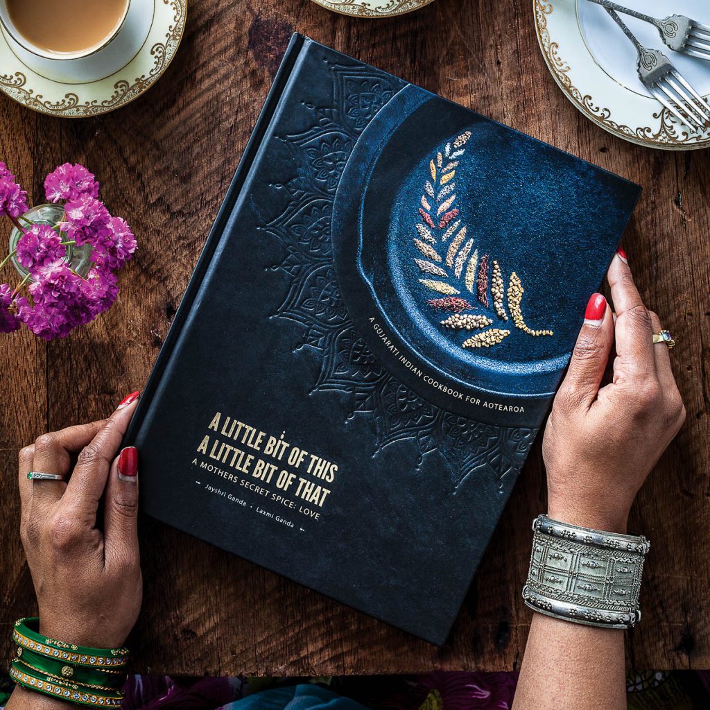 cookbook cover with hands in frame