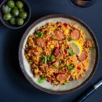 Spanish rice with chorizo in grey bowl