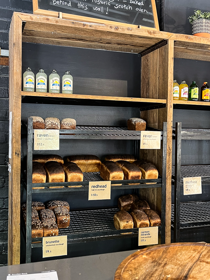 wooden shelf with sour dough bread loaves